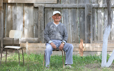 Fototapeta premium Kazakh old man, portrait of an asian old male farmer