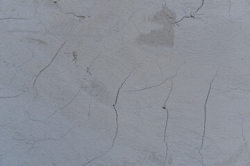 Cracked gray stucco background. TMinimalistic loft texture.