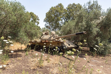A battered  Syrian tank of Soviet manufacture is after the Doomsday (Yom Kippur War) on the Golan Heights in Israel, near the border with Syria