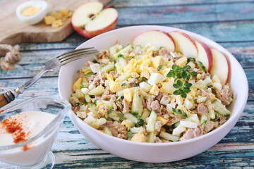 Tuna salad with cucumber, eggs and spicy sauce