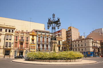 Group of historic modernist buildings a intricately designed street lamp called La Farola from...