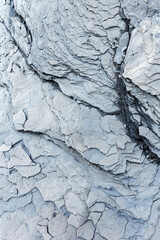 Grey shale cliff background.