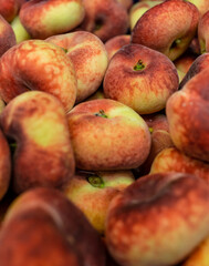 ripe red-yellow peaches in large quantities. shot at close range. Plenty of delicious juicy fruit. High quality photo