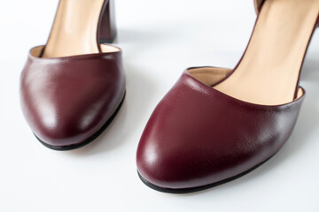 Womens leather cherry shoes on a white background