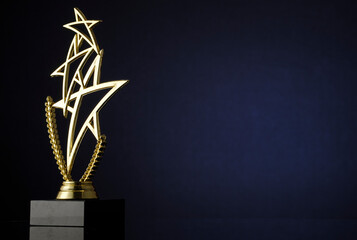 Stylish trophy with three gold stars and wreath