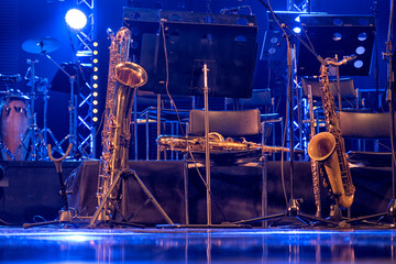 musical instruments, saxophone, guitar, on stage before the concert