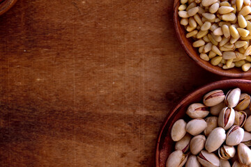 Mix of nuts in a wooden bowl