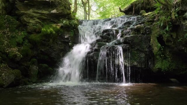 Waterfall in a beautiful green woodland in Yorkshire, Gorpley Clough woods