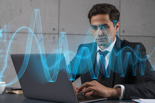 Businessman in office working with laptop technology online trading graph and chart, typing computer assemble data drawing concept. Double exposure.