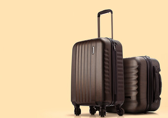 two suitcases standing on colored background