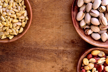 Mix of nuts in a wooden bowl