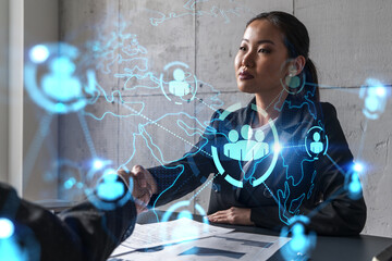 Two woman handshake. Social network hologram. Multiexposure. International business.