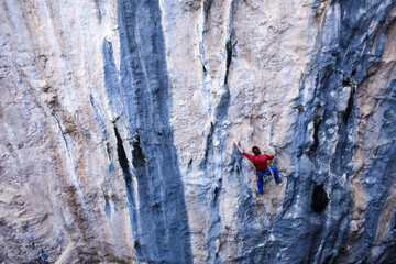 A strong man climbs a rock, Rock climbing in Turkey.