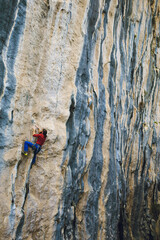 A strong man climbs a rock, Rock climbing in Turkey.