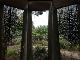 water fountain with water dripping and plants