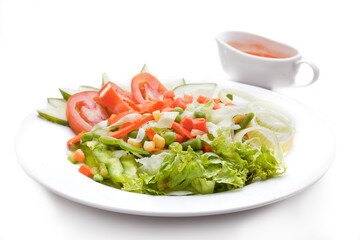 Salad. Vegetable salad consists of lettuce, long beans, peas, corn kernels, carrots, onions, tomatoes and cucumbers.