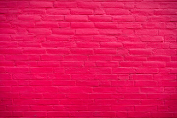 Fototapeta na wymiar Saturated pink brickwall Background with cement texture