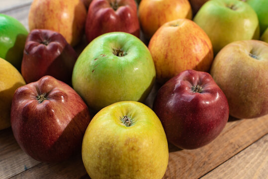 Tasty green, yellow and red apples. Healthy and nutritious food