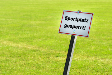 Sign shows sports ground is closed
