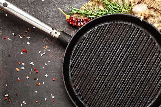 grill pan and species on old table