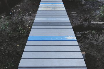 Fototapeta premium Cement bridge, natural mangrove forest path by the sea