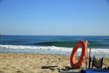 Lifebuoy on the sandy beach of Rethymno, Crete