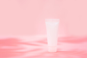 Cosmetics tube over background with shadow