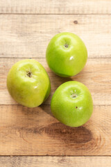 Ripe tasty apples on a wooden table. Healthy food