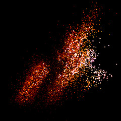 Glowing golden glitter scattered on a black background. Holidays creative composition.