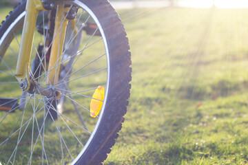 Detail of a  Bike Tire with sun Lights in the Background