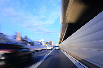 Fototapeta na wymiar car driving on highway in central Tokyo