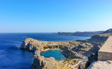 View from the ancient wall of the citadel of the Acropolis of Lindos on St Paul's Bay and the ocean. Rhodes. Greece.