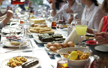 eating food on table .Family and friends gathering together at home for eating dinner    