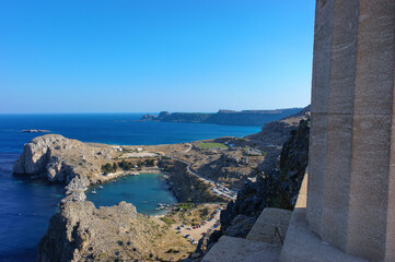 View from the ancient wall of the citadel of the Acropolis of Lindos on St Paul's Bay and the ocean. Rhodes. Greece.