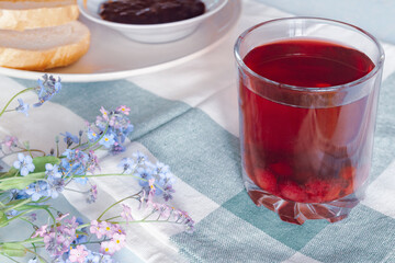 transparent glass with homemade blackcurrant compote.
