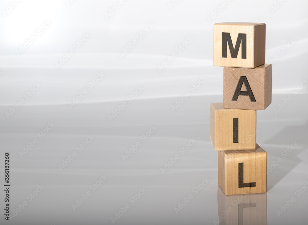 Fototapete word mail spelled on cube blocks dices on grey glossy background with reflection and copy space avai