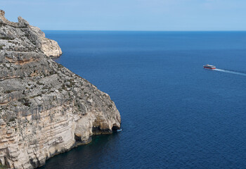 Nice Blue Grotto view in Malta island with two boat in the clear blue sea, touristic destination in...