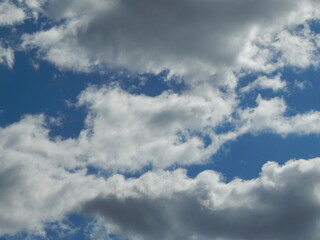 White fluffy clouds on a clear blue sky