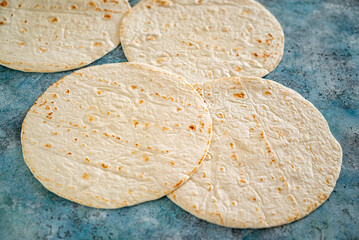 pita bread on the ble background