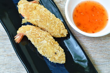 crispy fried shrimp coating flake bread and flour dipping with sweet chili sauce