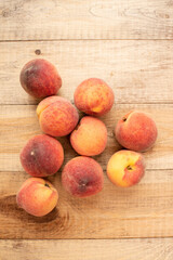 Large ripe and juicy peaches on a wooden table. Healthy diet