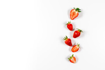 Flat lay composition with fresh juicy strawberries on grey background, space for text
