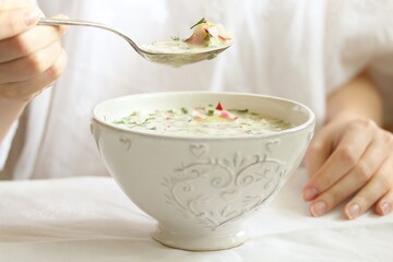 okroshka - Russian cold soup and hands. Space for text. copy space