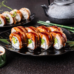 fresh and tasty sushi on the black background