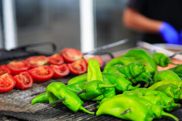 Grilled tomatoes and peppers.Barbecue on delicious , red and green peppers and tomato cooking.