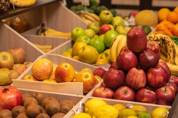 A counter with juicy and delicious fruits. With lots of wholesome food