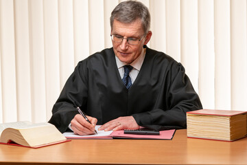 Judge or lawyer signing a judgement or a brief
