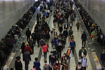 masked metro crowd in hong kong