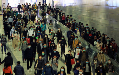 masked metro crowd in hong kong