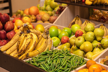 A counter with juicy and delicious fruits. With lots of wholesome food